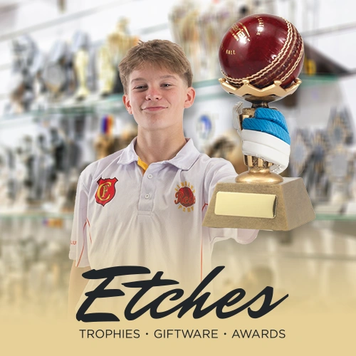 Boy with cricket trophy